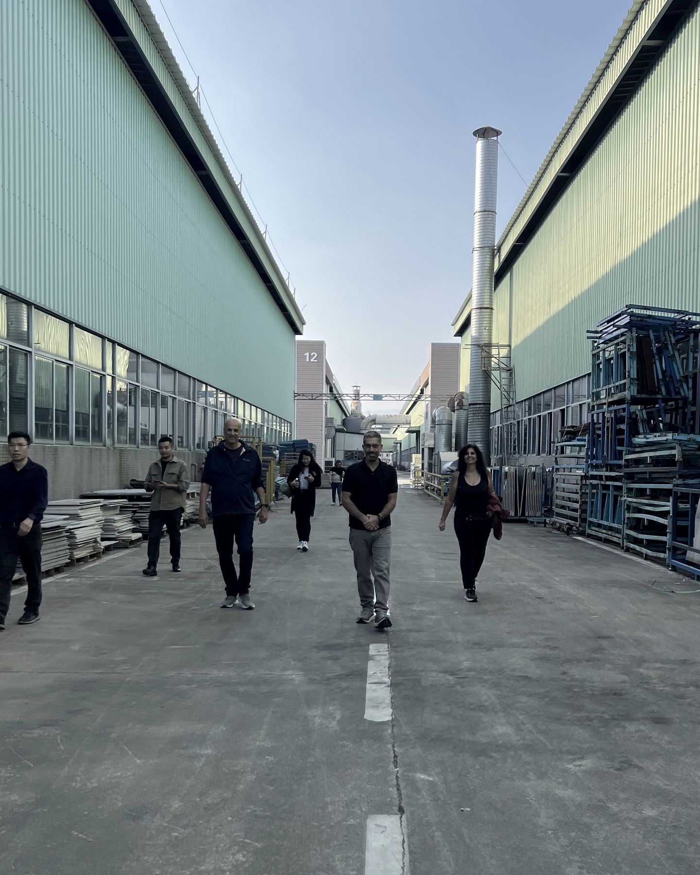 Telop and client walking a supplier’s yard